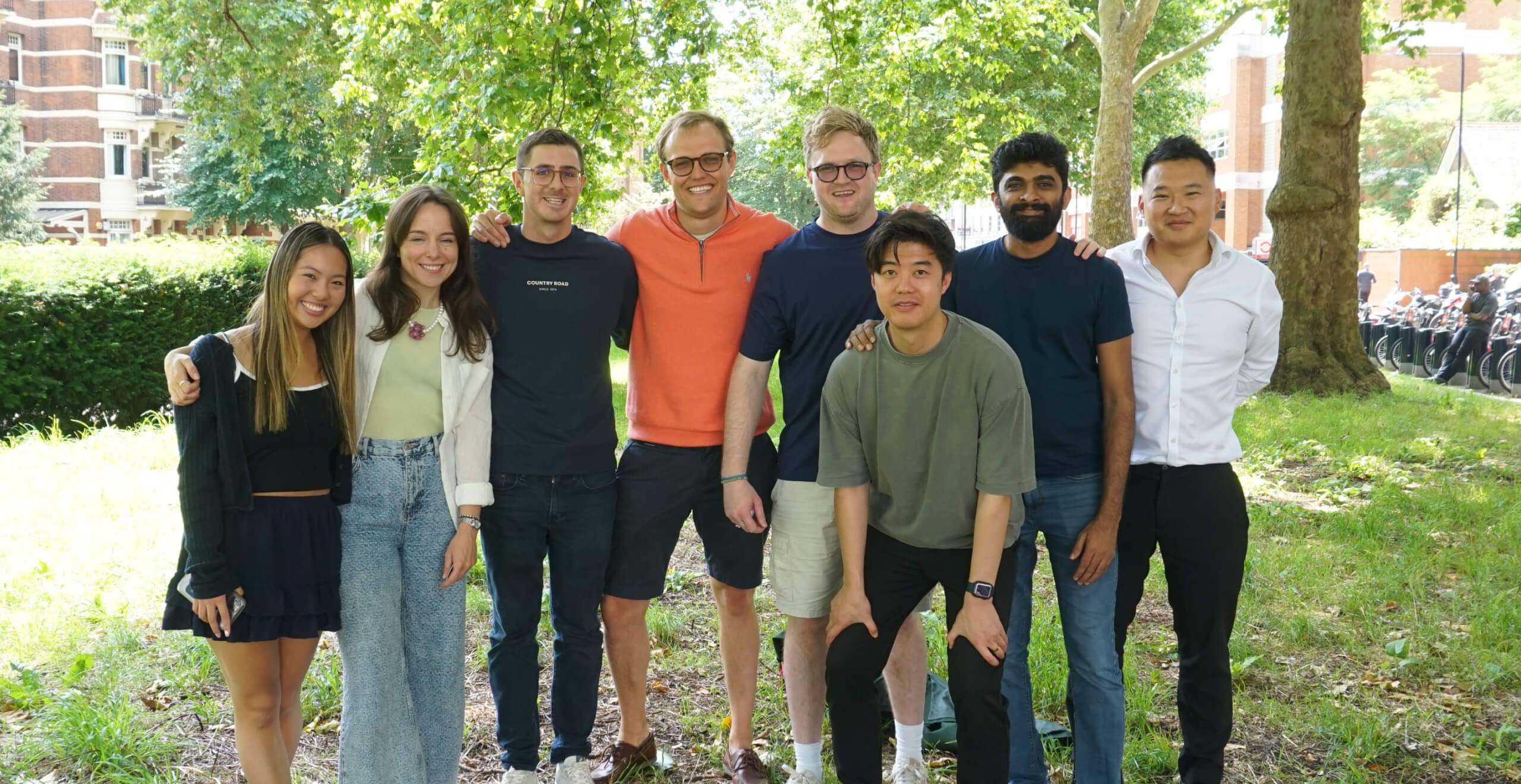 The Blott team standing together under trees in a London park